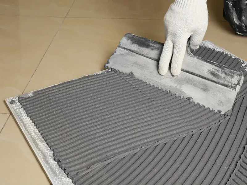 Tile adhesive application for marble floor installation London